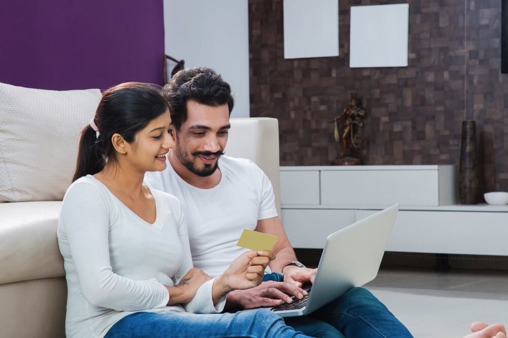 Couple buying online scratchcards