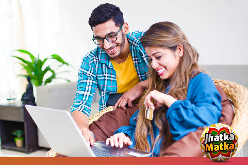 Couple smiling learning how to play Matka online